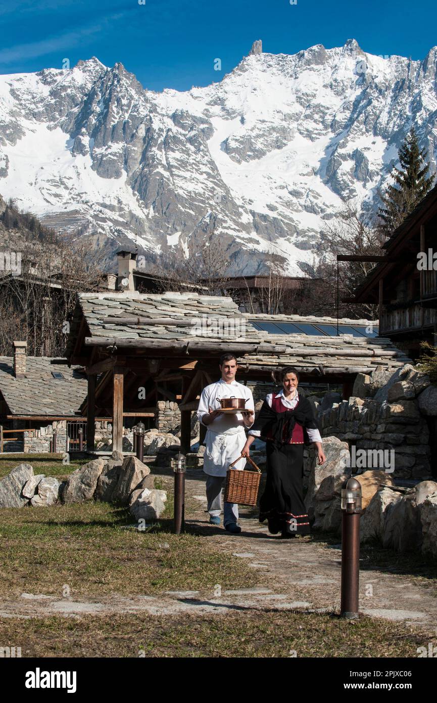 Room service at the luxury chalet resort Au Coeur des Neiges, Strada Statale 26, in the background view on the Dente del Gigante and the crest of the Stock Photo