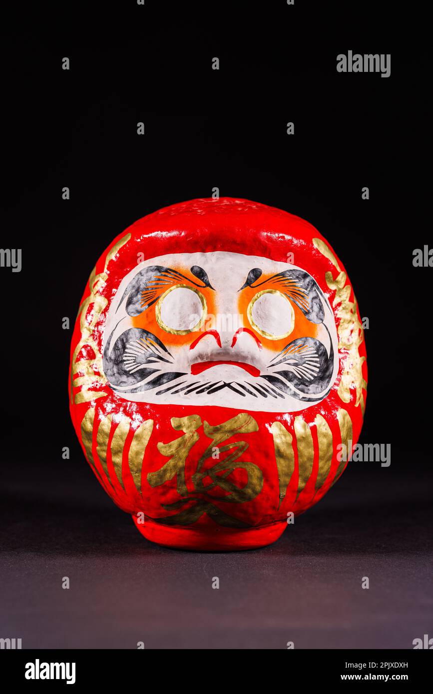 Japanese Daruma doll. Translation: Fortune. Daruma dolls are seen as a  symbol of perseverance and good luck, making them a popular gift of  encouragement. Stock Vector