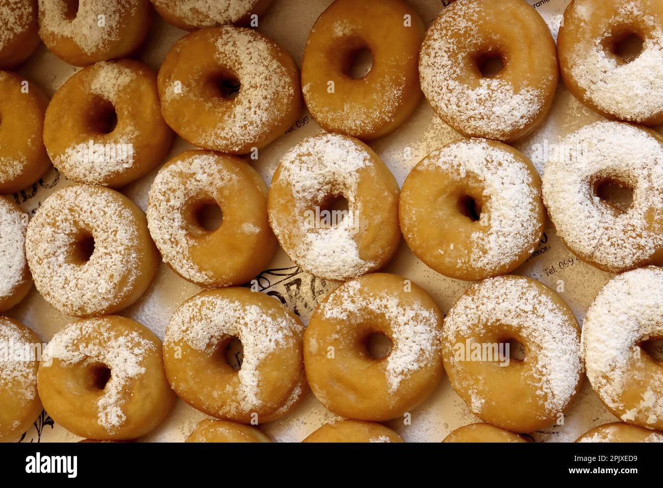 Pack of fried donuts with powdered sugar Stock Photo Alamy