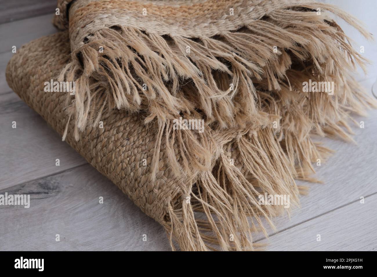 Fringed woven jute carpet rug , woven jute rug with fringe folded on