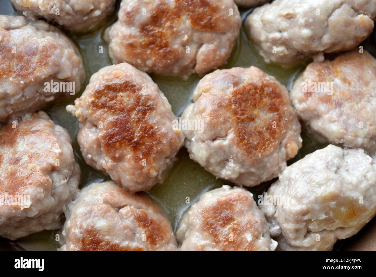 Fried meat patties in a frying pan. Delicious fried meat. Steak Stock