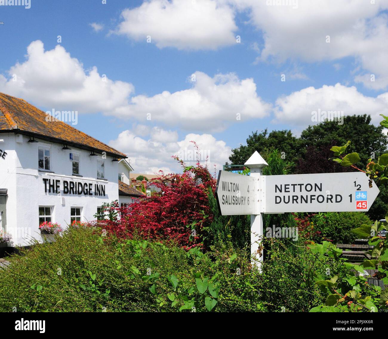 The Bridge Inn at Upper Woodford, beside the river Avon in the Woodford Valley, Wiltshire. Stock Photo