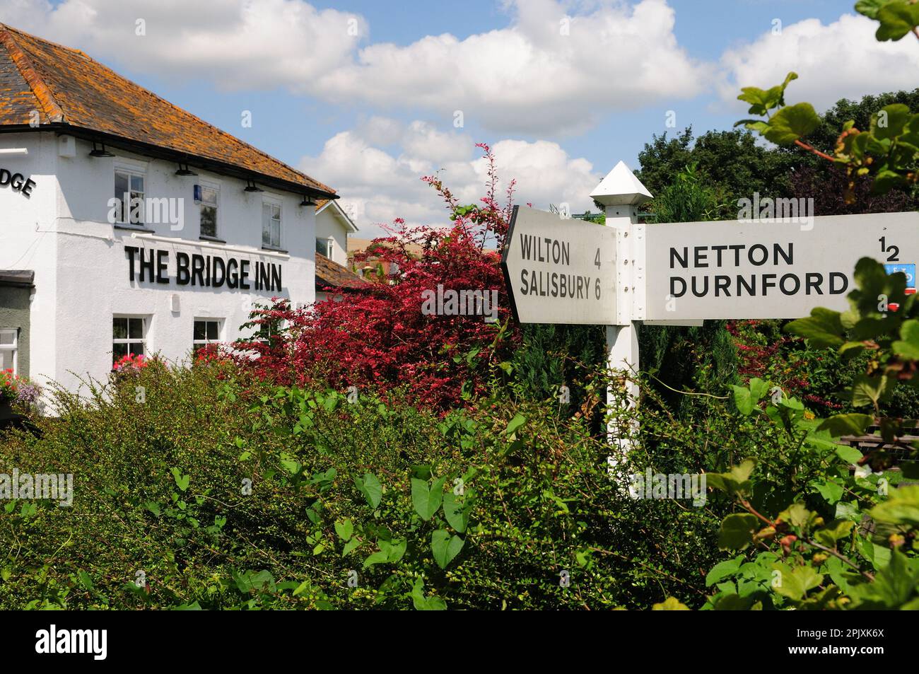 The Bridge Inn at Upper Woodford, beside the river Avon in the Woodford Valley, Wiltshire. Stock Photo