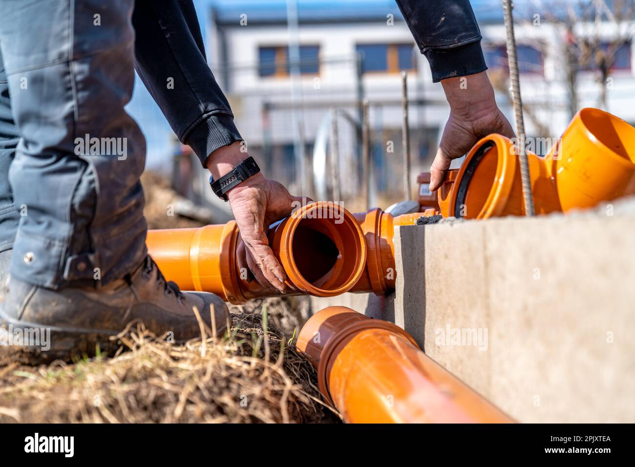 installation of a sewage plastic pipe during the construction of a