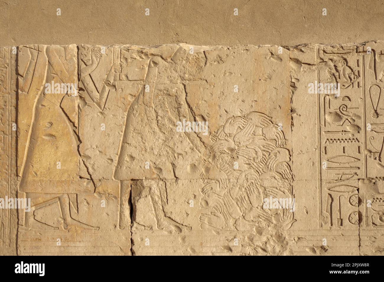 Detail of hands of the losers in battle scenes in forecourt of Temple of Seti I, Abydos, Egypt Stock Photo