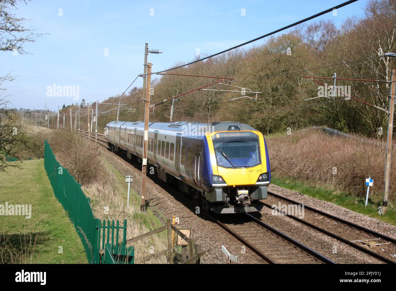 Northern trains civity class 195 dmu, 195117, passing along the West Coast Main Line in the Lancashire countryside near Scorton on 4th April 2023. Stock Photo