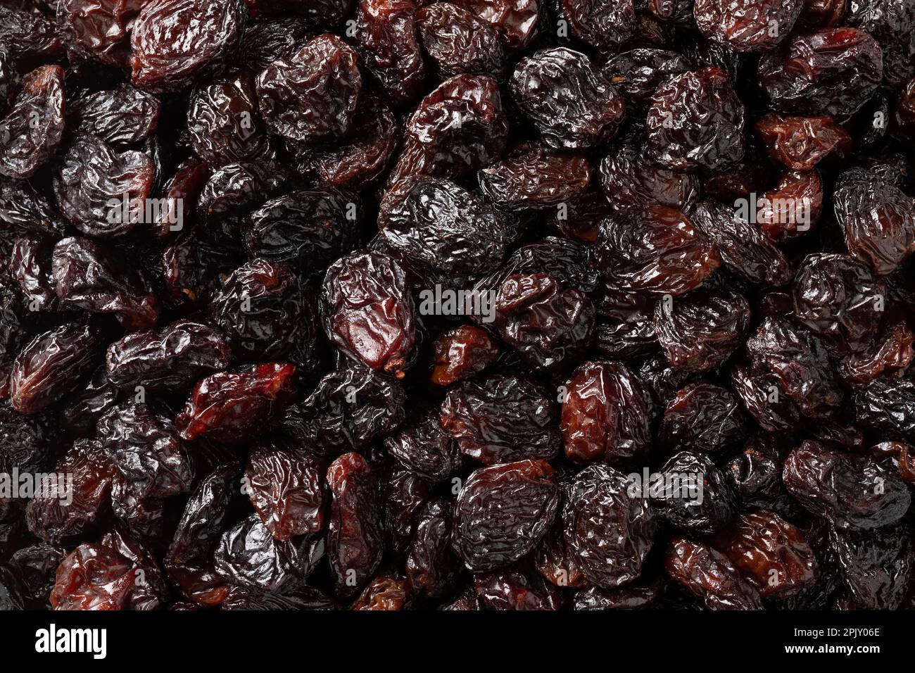 Black flame raisins from Chili full frame close up as background Stock Photo