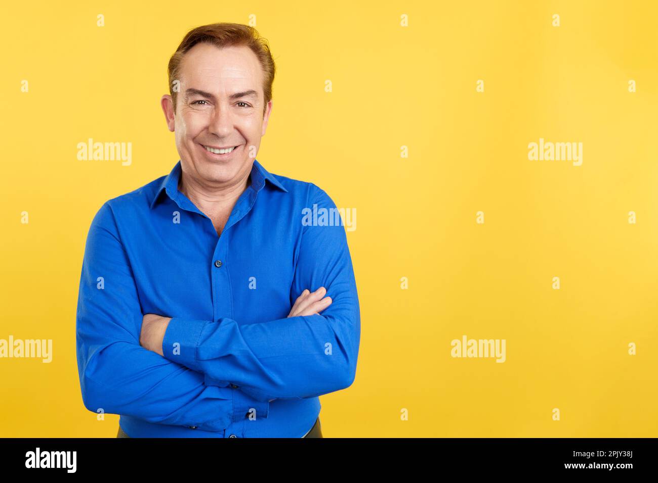 Smiling man standing arms crossed hi-res stock photography and images ...