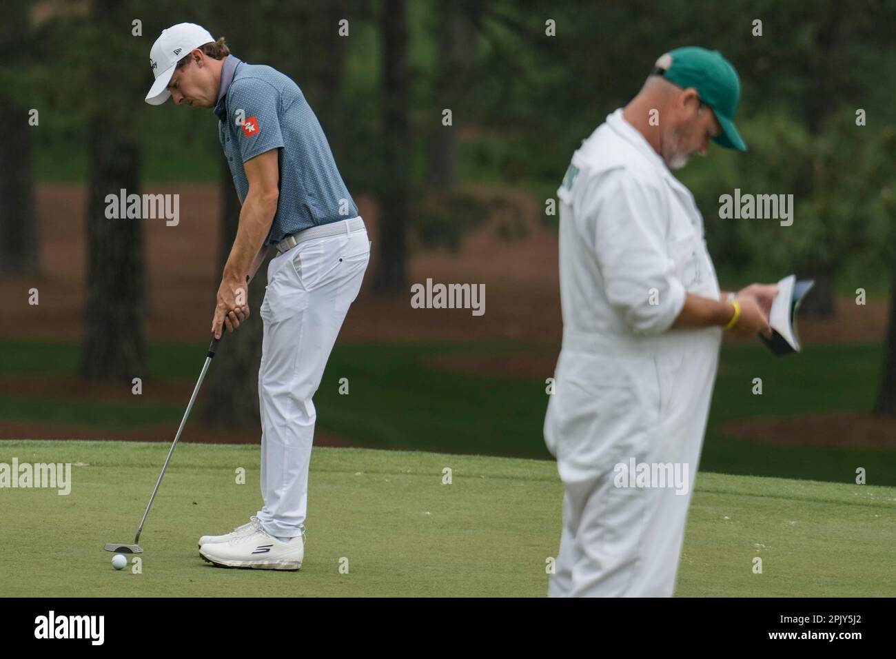 Matt Fitzpatrick, of England, and his caddie Billy Foster stand on the