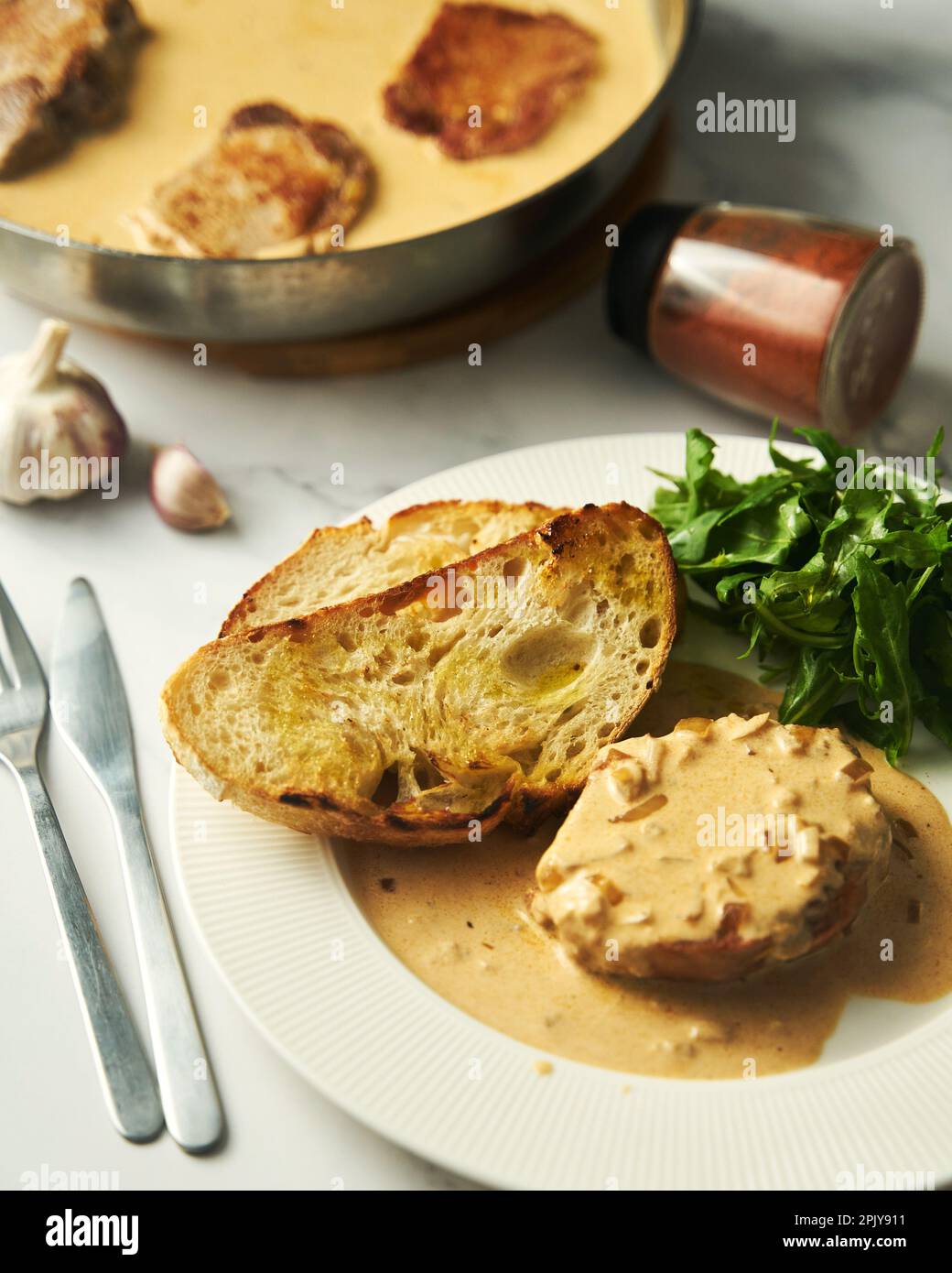 Pork paprikash with onion, butter and garlic. Sauce made from high fat