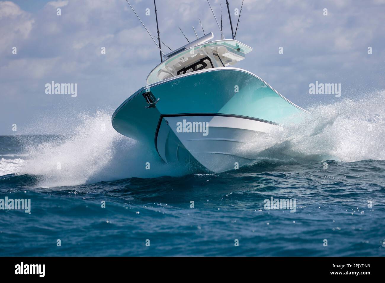 An approaching center console boat turning hard at high speed Stock
