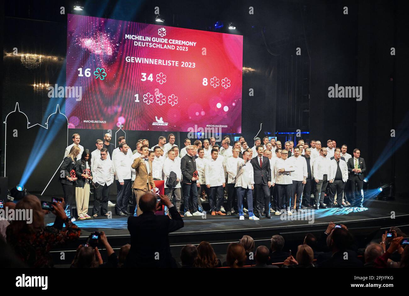 Karlsruhe, Germany. 04th Apr, 2023. At the award ceremony of the restaurant guide Guide Michelin for Germany, the award-winning chefs stand on stage at the end of the event. Credit: Uli Deck/dpa/Alamy Live News Stock Photo
