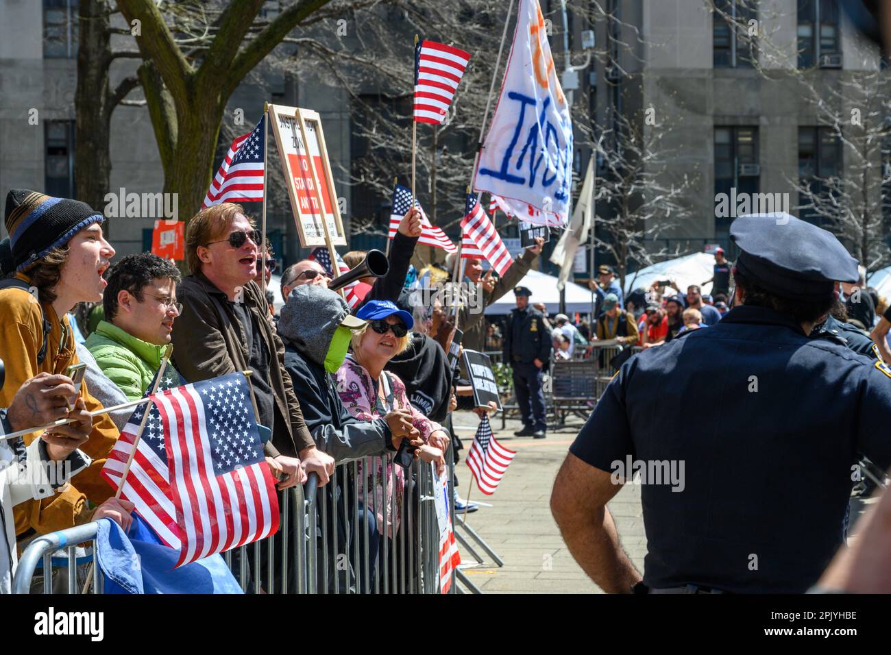New York, USA. 4th Apr, 2023. Police keep guard as demonstrators protest against former US President Donald Trump outside of the New York Criminal Court as they await Trump's arrival. Donald Trump became the first former US president to be indicted by a grand jury and surrendered to the authorities to face criminal charges. Credit: Enrique Shore/Alamy Live News Stock Photo