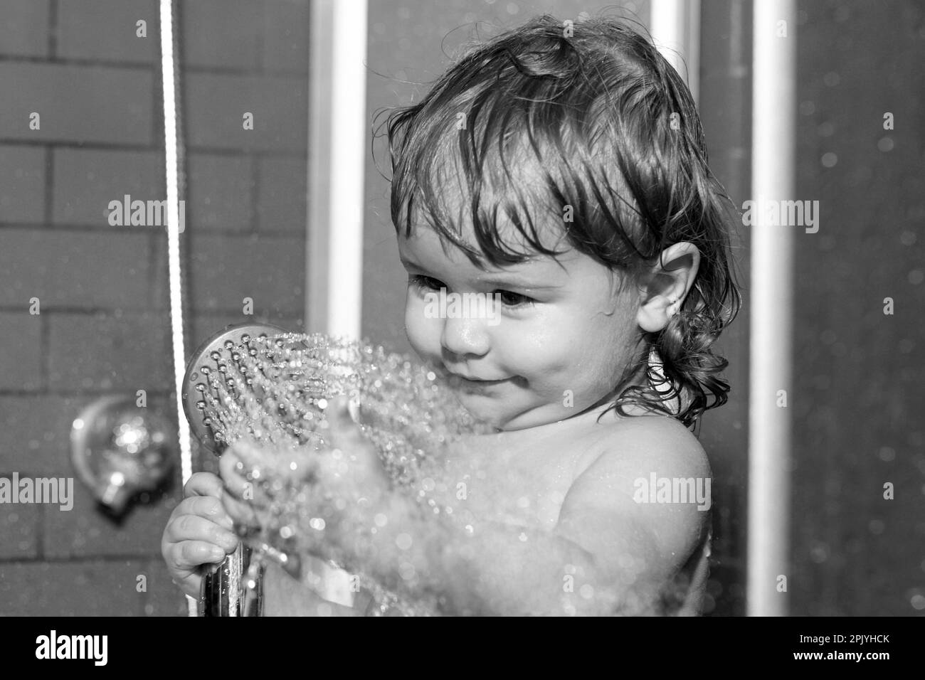 Wash infant hygiene and health care. Washing adorable baby in bathroom