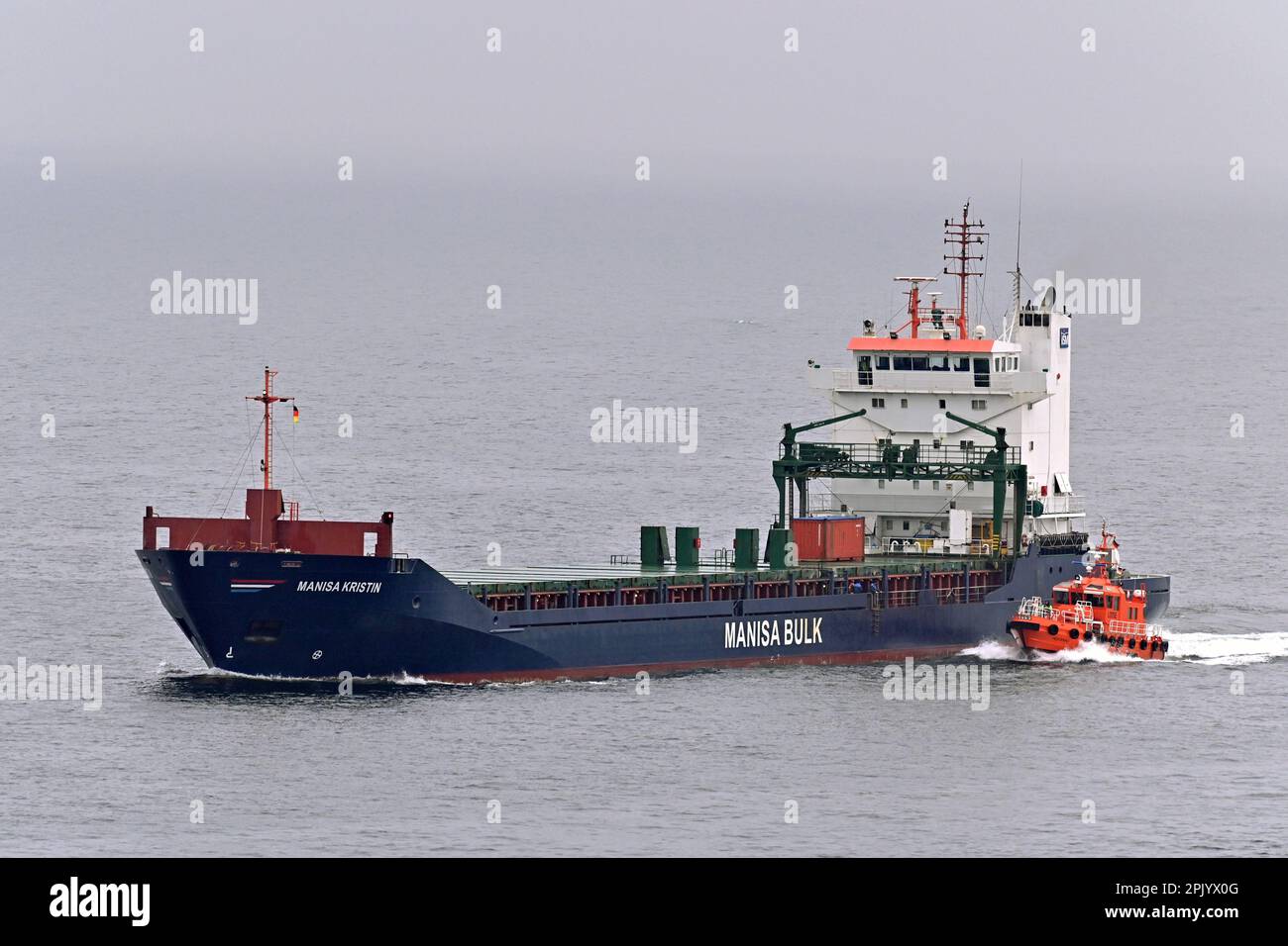 General cargo Ship MANISA KRISTIN taking pilot at the Kiel lighthouse Stock Photo