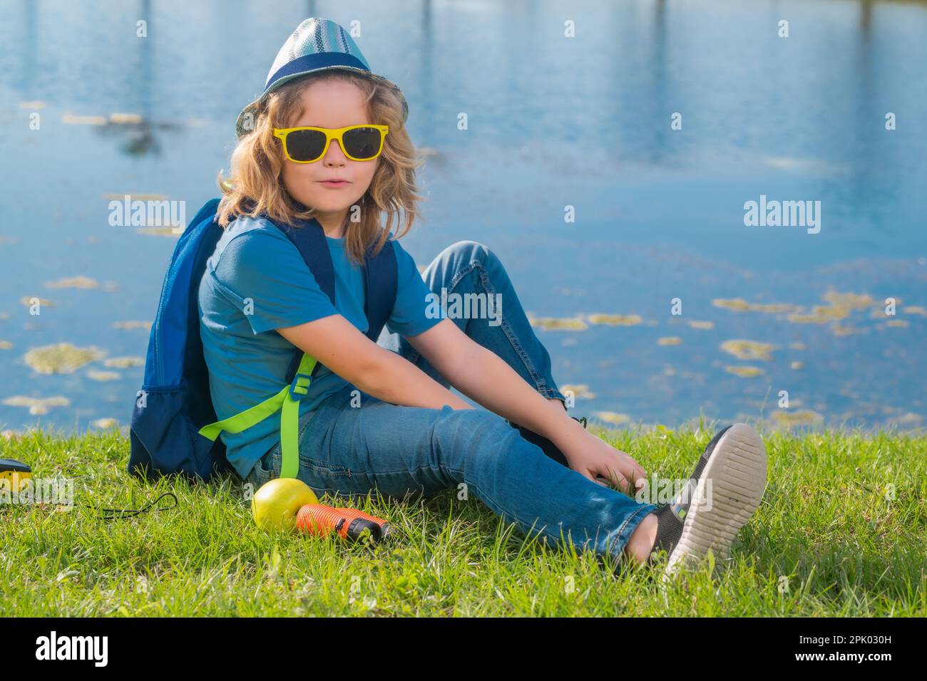Travel and adventure concept. Little child boy tourist explorer with binoculars on nature. Discovery, exploring and education Stock Photo