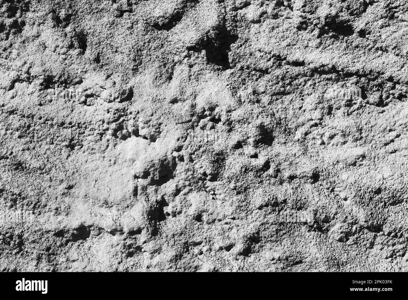 Abstract background stock photo close up of dark gray concrete wall plastered with rough texture Stock Photo
