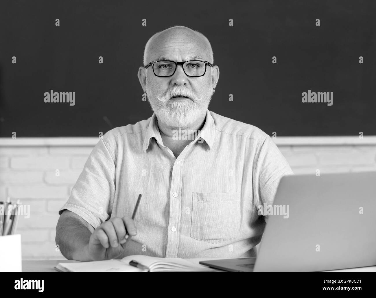 Portrait Of Senior Teacher Teaching Line Of High School Students With portrait-of-senior-teacher-teaching-line-of-high-school-students-with