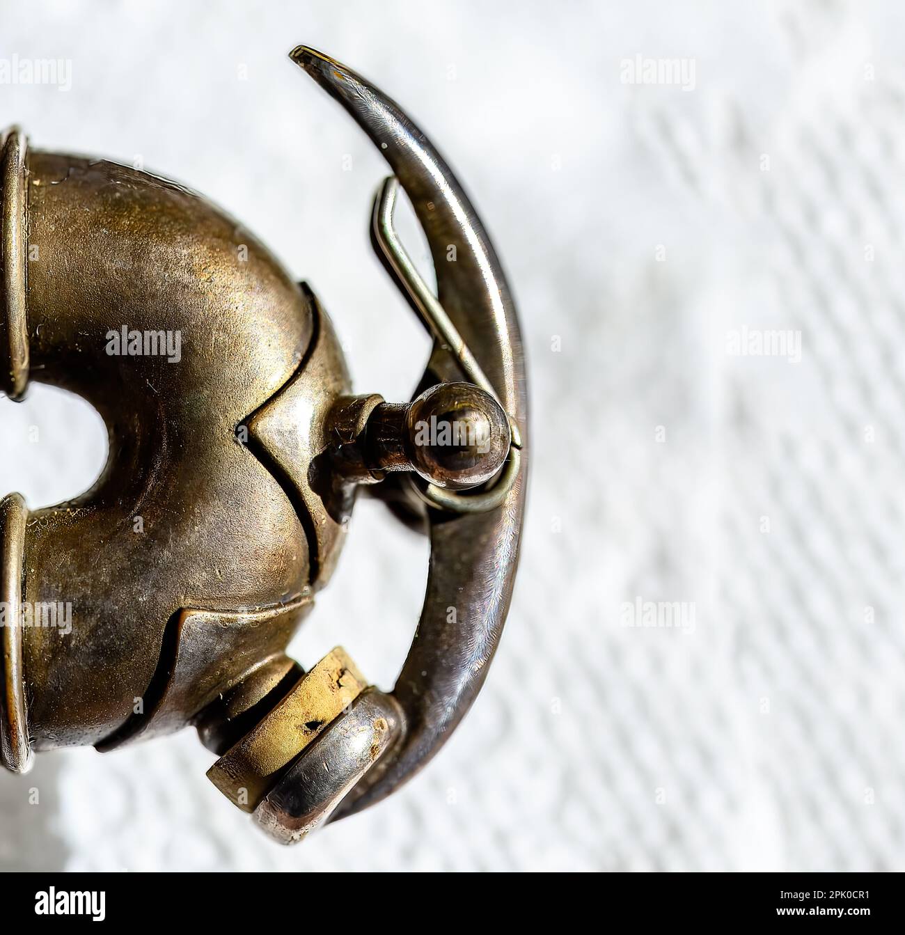 Selective focus on a water key of an aged wind instrument trumpet Stock