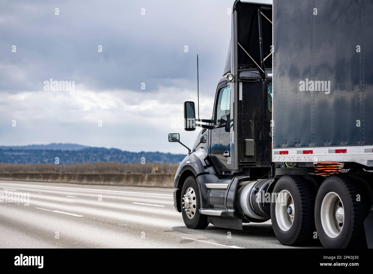 Day cab local freight black big rig industrial semi truck tractor with ...
