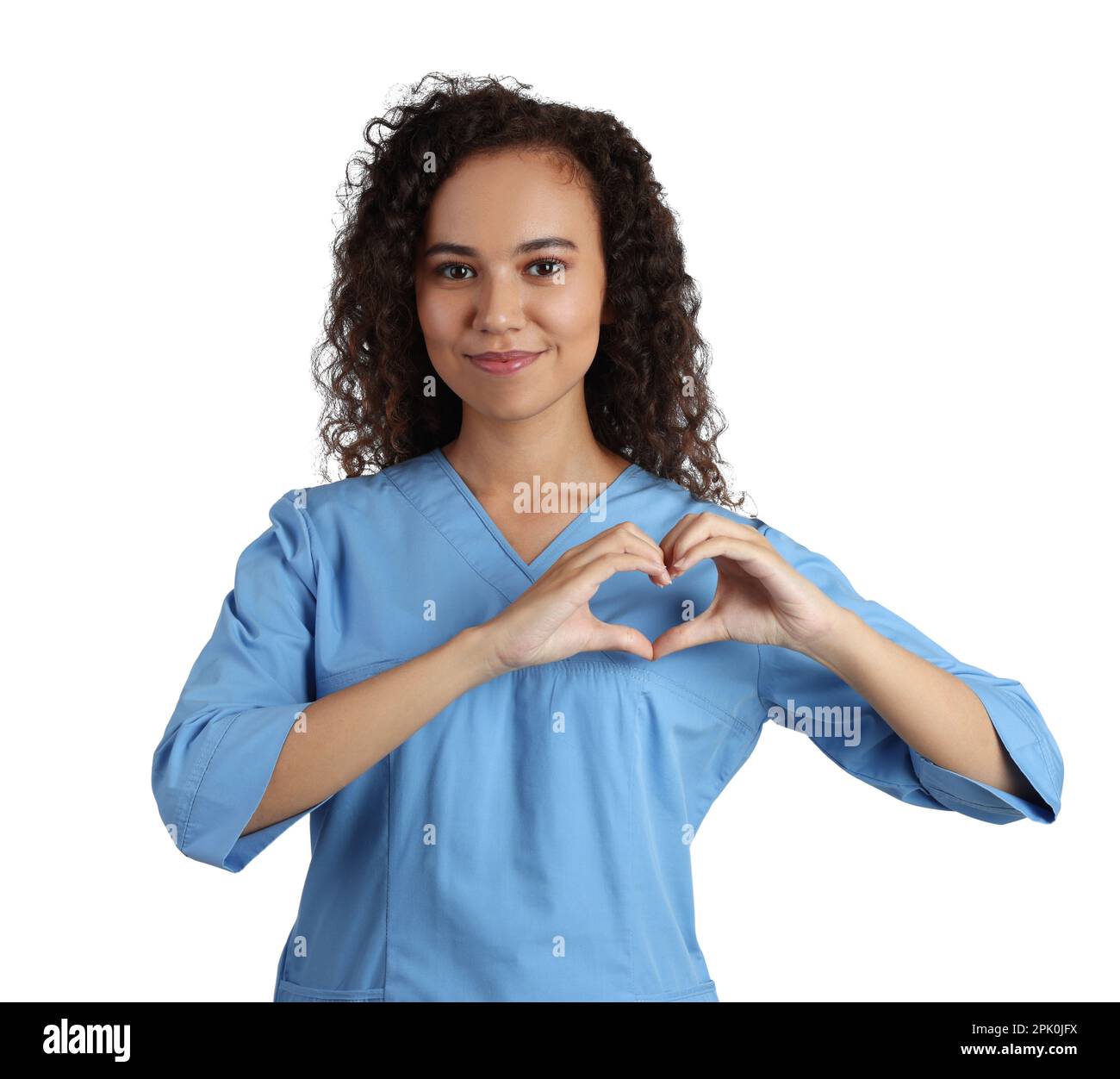 Happy young African-American doctor making heart with hands on white ...