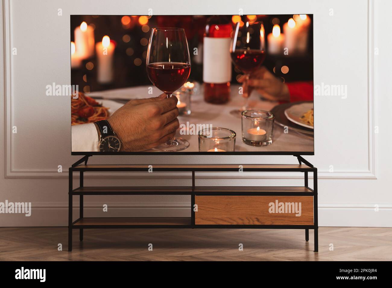 Scene of romantic movie on TV in room Stock Photo