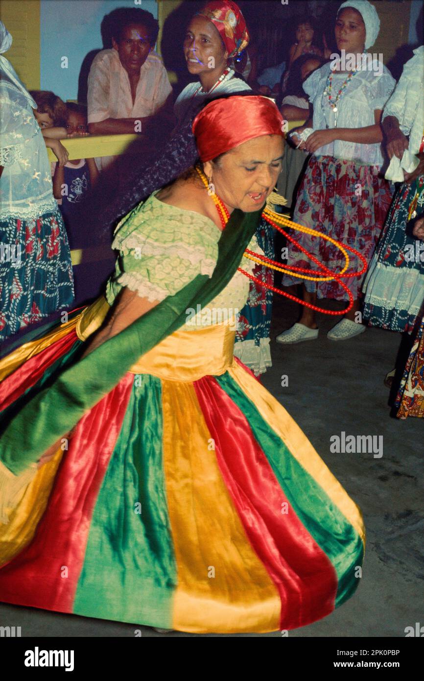 Tambor de Mina, syncretic Afro-Brazilian spirit possession religion. The 'mãe de santo'  is in transe, possessed by the 'caboclo' spirit Herondina. Stock Photo