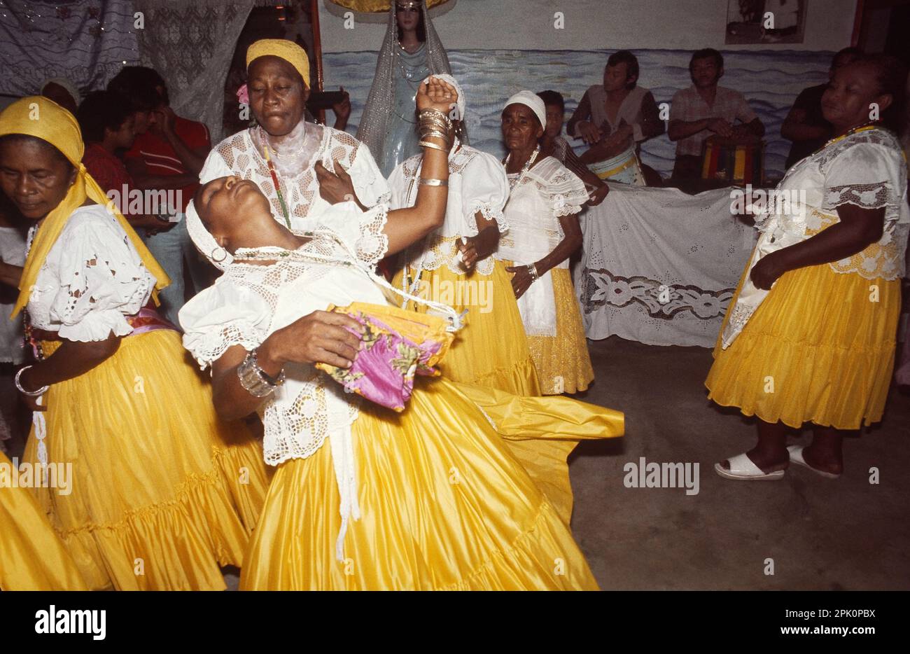 Tambor de Mina, syncretic Afro-Brazilian spirit possession religion. A 'filha de santo' (cult member) goes into a trance, possessed by a spirit. Stock Photo