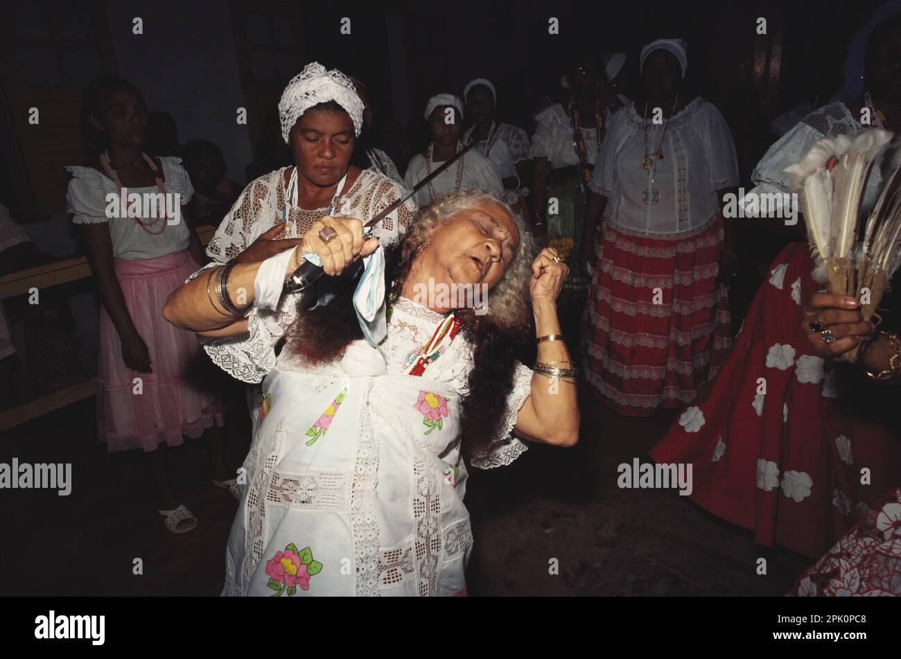 Tambor de Mina Afro-Brazilian spirit possession religion. Mãe de santo (cult leader) in trance, possessed by Santa Barbara (African orishá Iansã). Stock Photo
