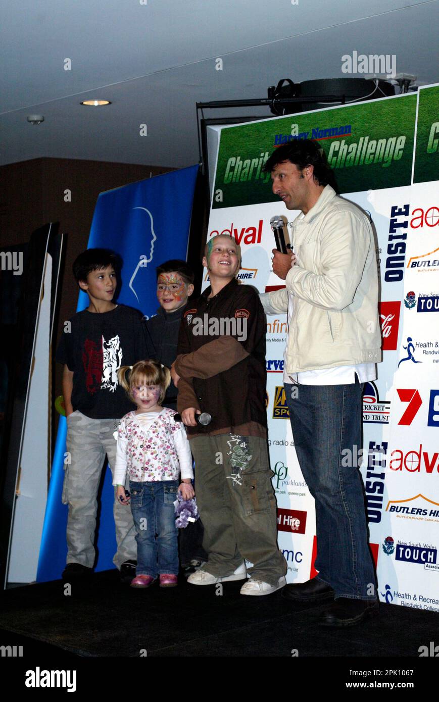 NRL footballer Laurie Daly with leukemia sufferer Anthony Benton and his siblings at the Charity Media Challenge, in which teams from leading media organizations compete in touch football matches to raise funds for leukemia research.   $115,000 was raised on the day, bringing the total funds raised to $350,000 in the three years that the annual event has been held.  The Grand Final game was held between the teams from Fox Sports and News Limited, with Fox Sports winning the game with a full-time score of 3 to 1. Sydney Football Stadium, Sydney, Australia. 19.08.07. Stock Photo