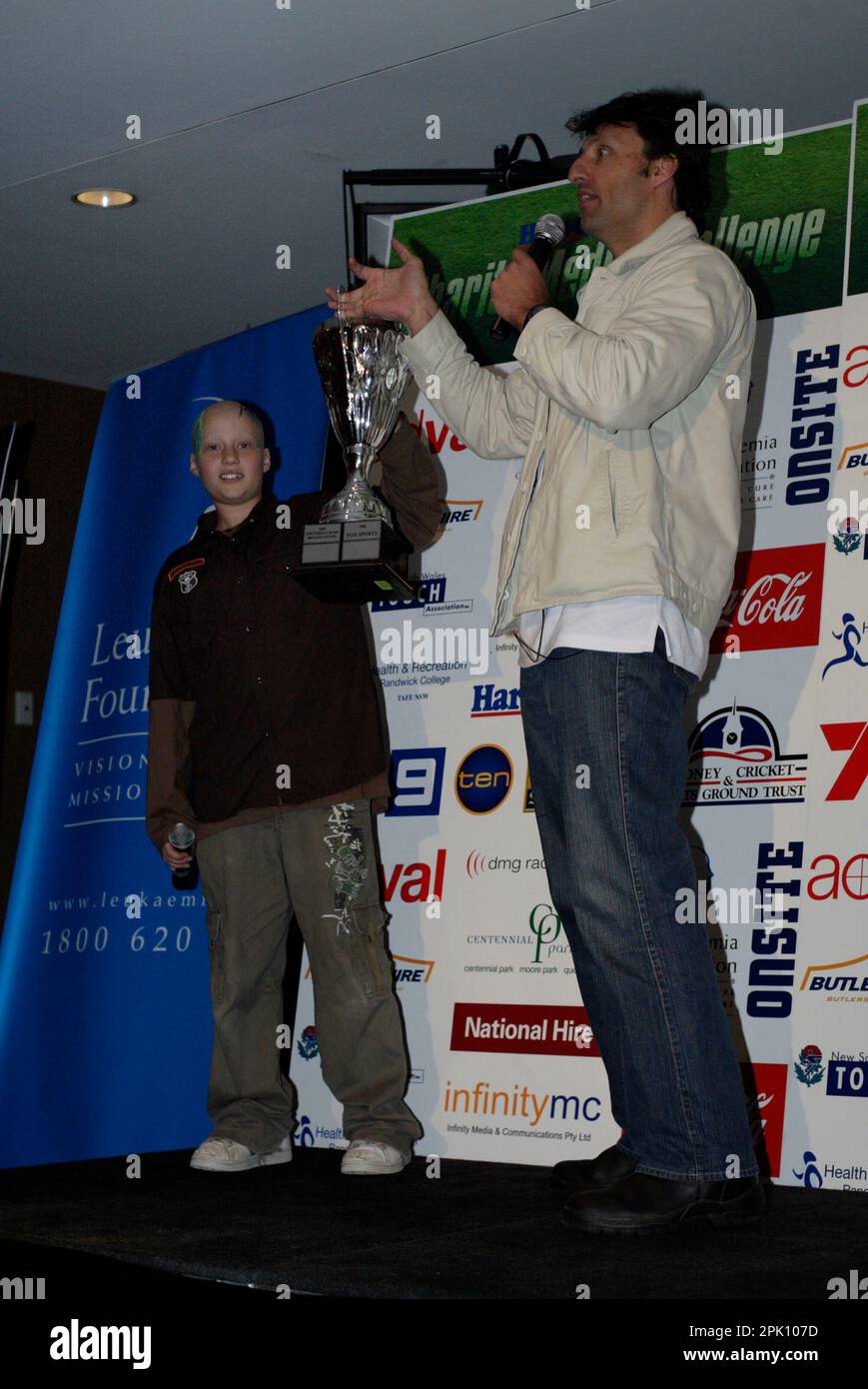 NRL footballer Laurie Daly with leukemia sufferer Anthony Benton at the Charity Media Challenge, in which teams from leading media organizations compete in touch football matches to raise funds for leukemia research.   $115,000 was raised on the day, bringing the total funds raised to $350,000 in the three years that the annual event has been held.  The Grand Final game was held between the teams from Fox Sports and News Limited, with Fox Sports winning the game with a full-time score of 3 to 1. Sydney Football Stadium, Sydney, Australia. 19.08.07. Stock Photo