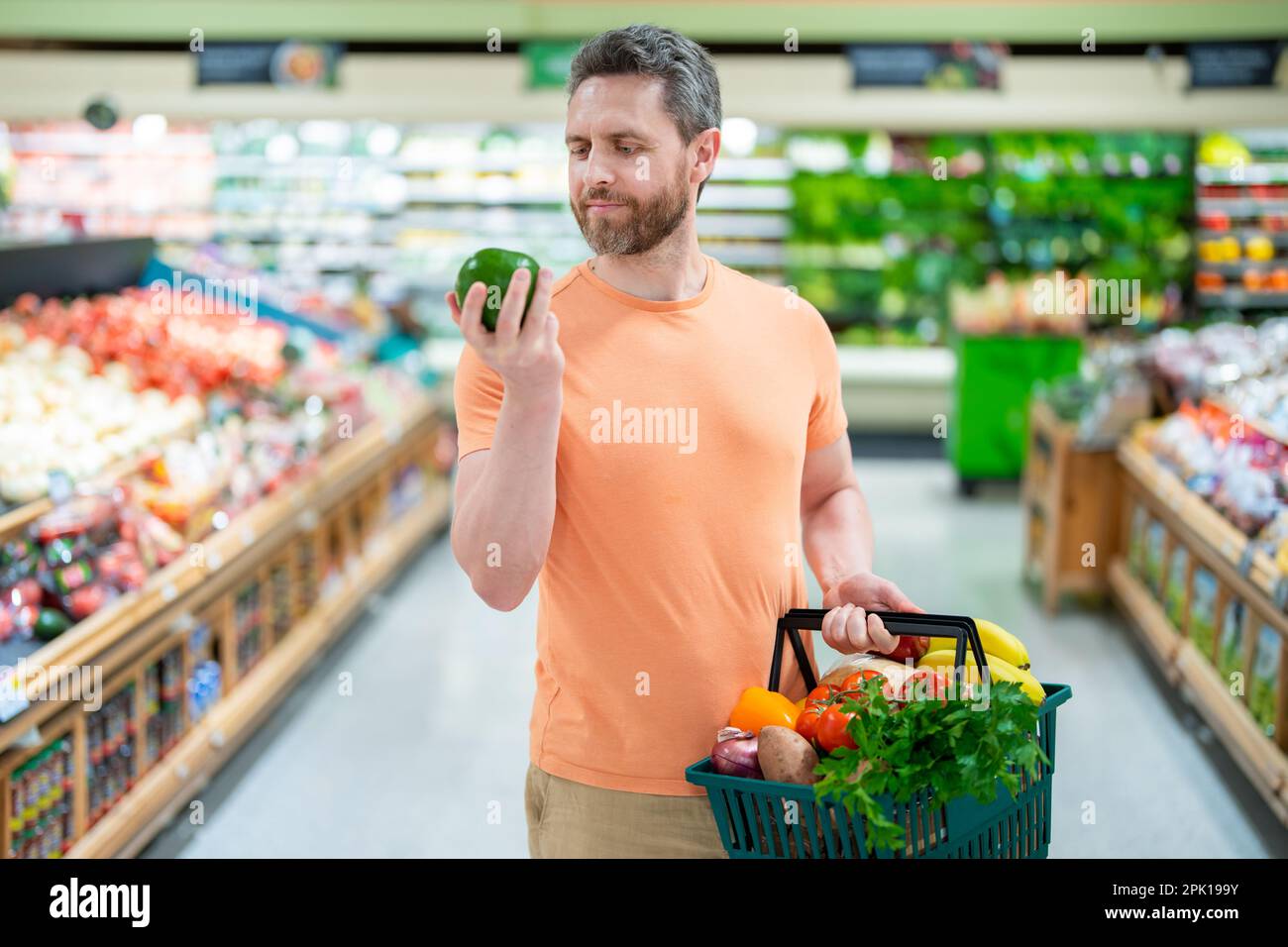 Store with people concept. Shopping at store, discount, sale concept. Man  with shopping basket at store. Supermarket and grocery shop concept. Man  Stock Photo - Alamy