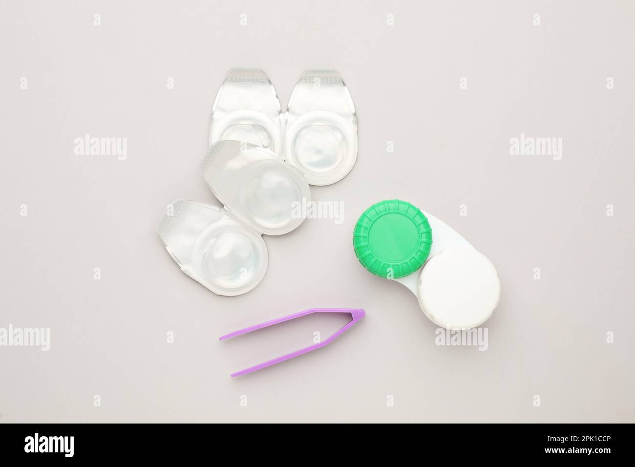 Contacts Package Packages with contact lenses, case and tweezers on white background ...