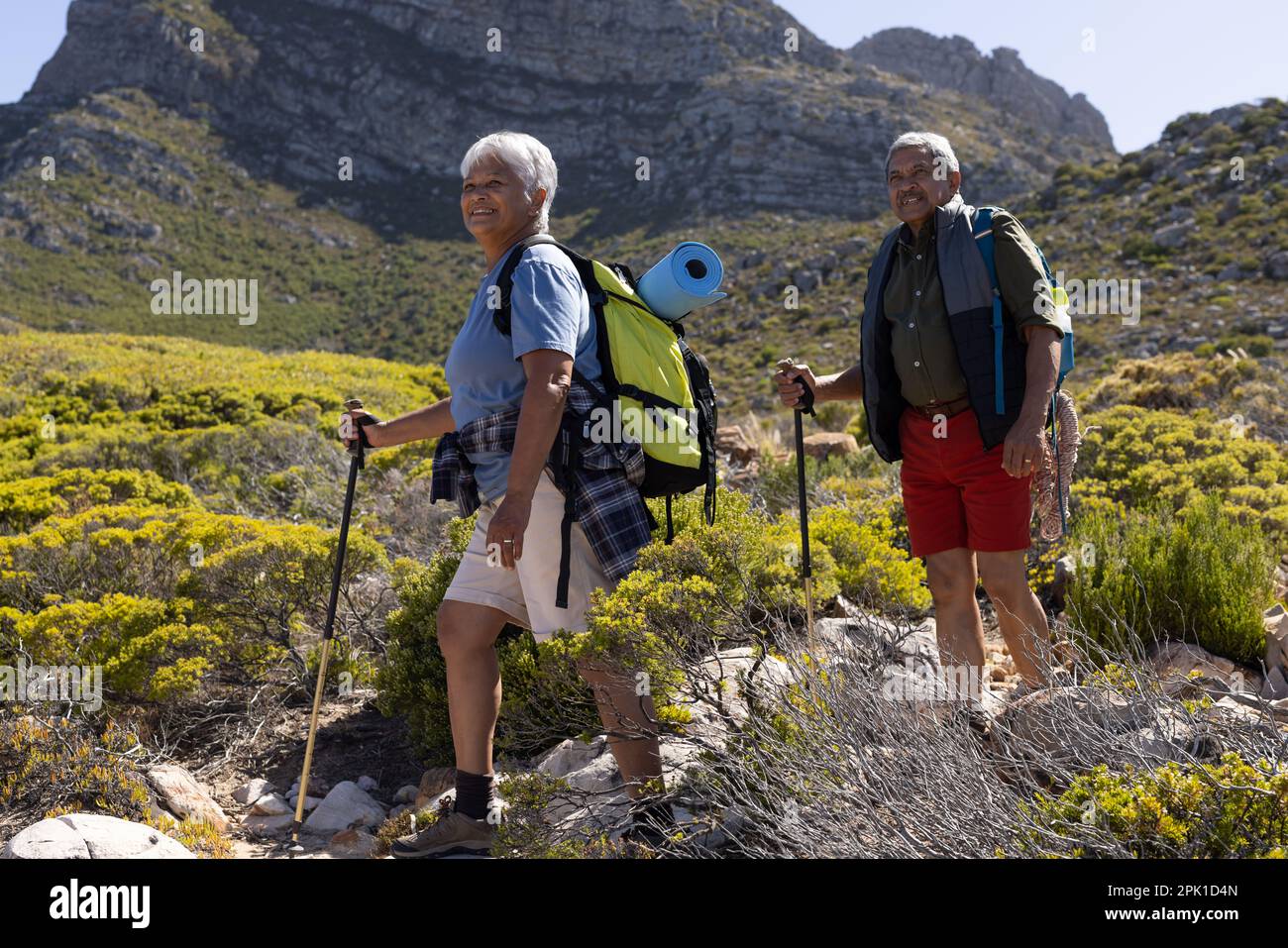 Biracial couple wearing backpacks hi-res stock photography and images ...