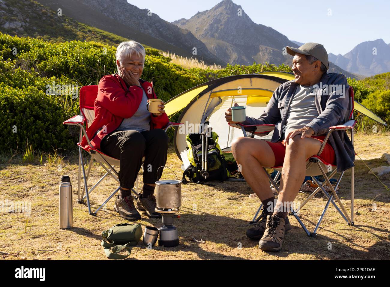 Couple sitting on camping chairs hi res stock photography and