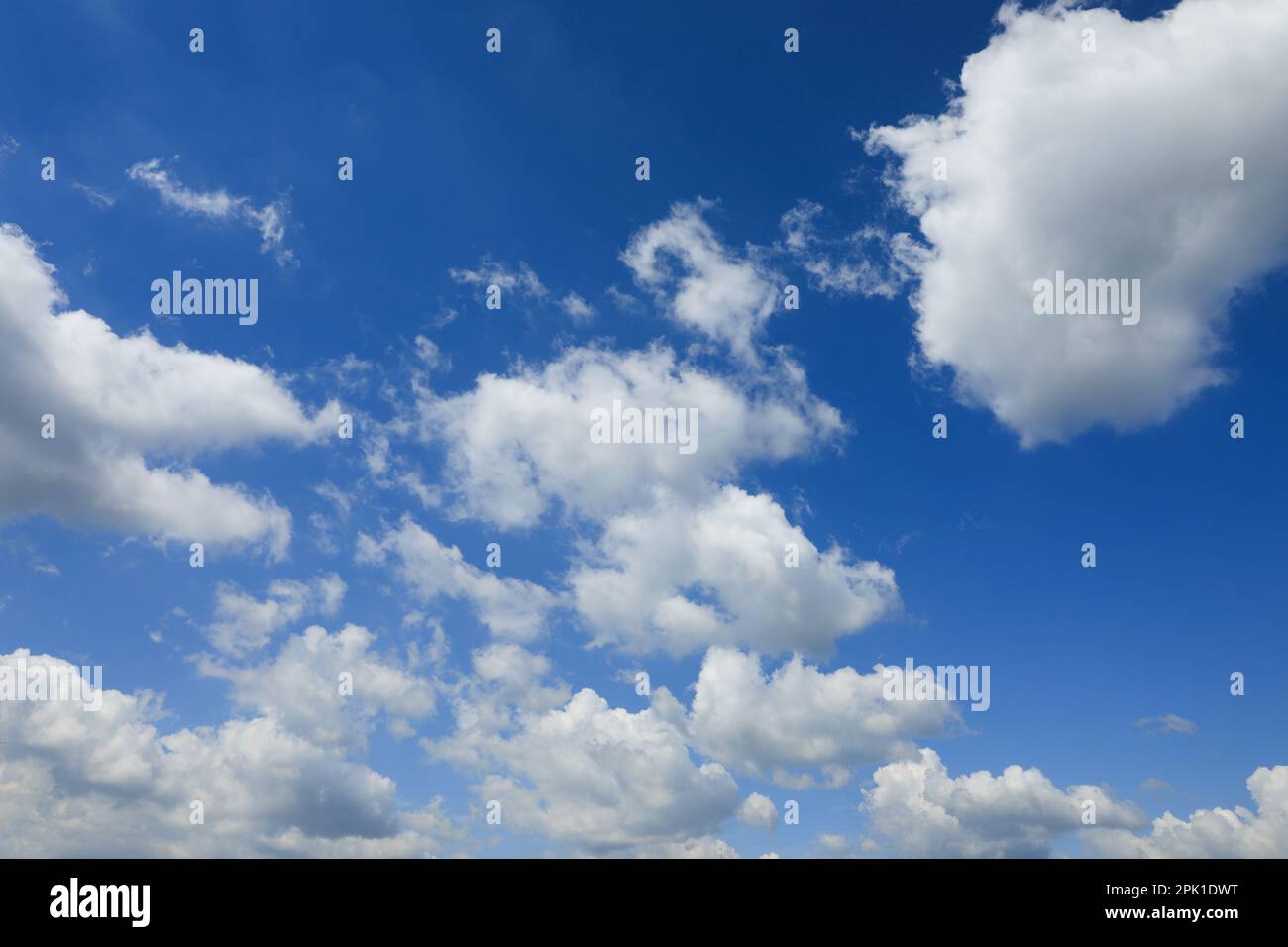 Beautiful blue sky with white fluffy clouds Stock Photo - Alamy