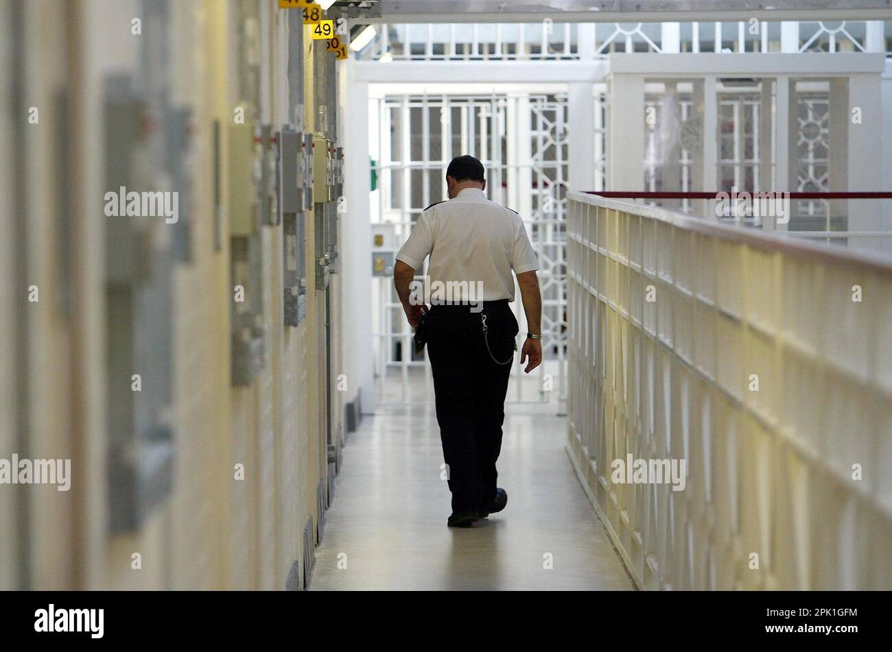 File photo dated 25/03/04 of a general view of inside a prison. Prison officers can work 24-hour shifts at weekends while inmates are sometimes unable to access medical care or do basic tasks, a report has found. His Majesty's Inspectorate of Prisons found 60% of male prisoners and 66% of female inmates said they spend less than two hours out of their cell on a typical Saturday or Sunday. On a weekday 42% of male prisoners and 36% of female inmates said they spend less than two hours a day outside their cell. Issue date: Wednesday April 5, 2023. Stock Photo