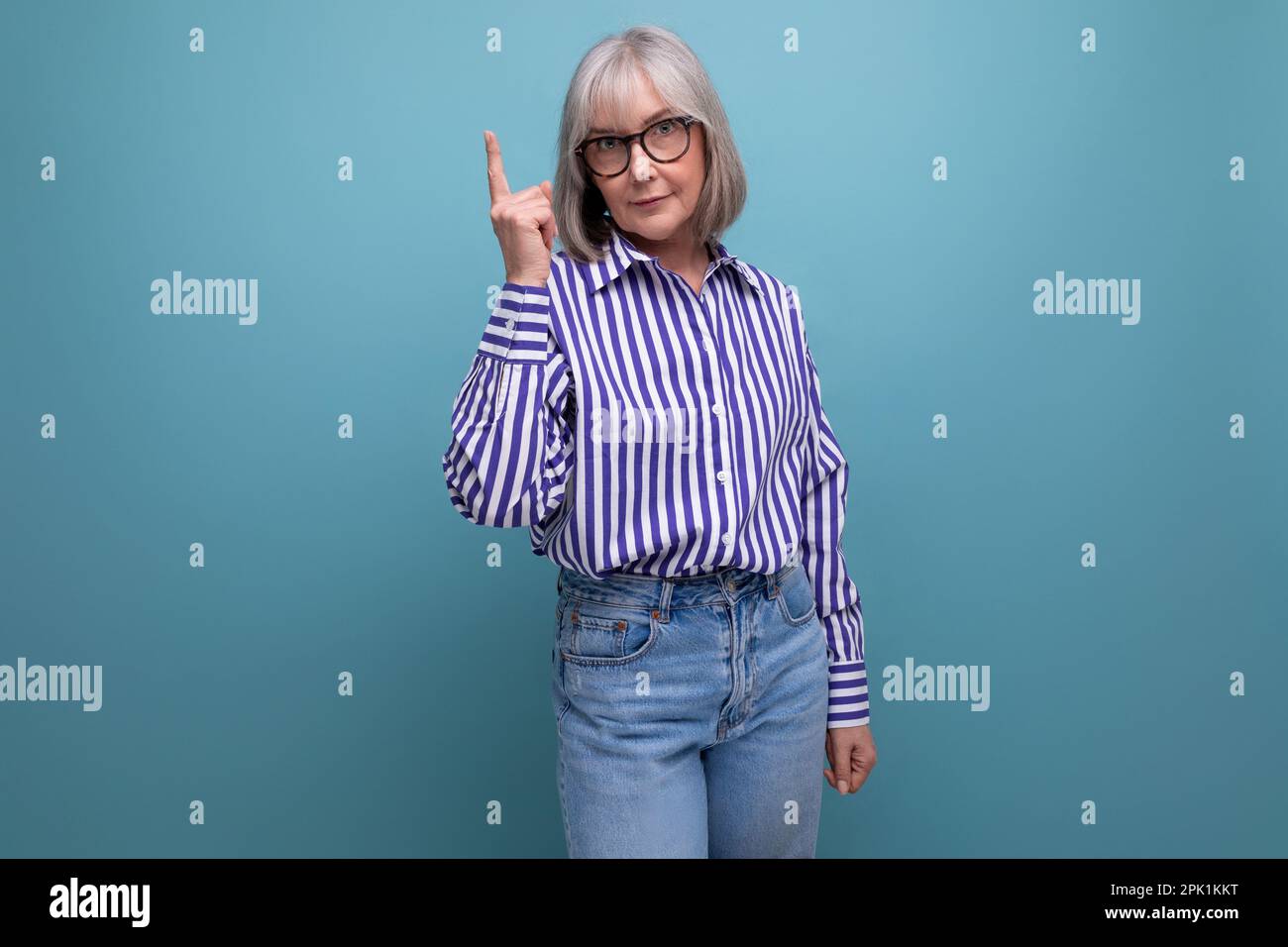 modern 60s middle aged woman with gray hair in a stylish look with a ...