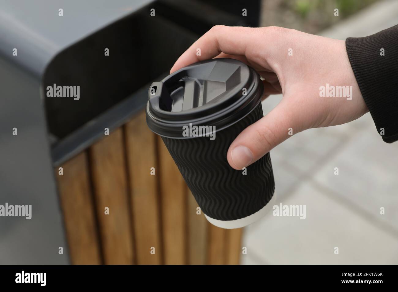 Person throwing away trash hi-res stock photography and images - Alamy