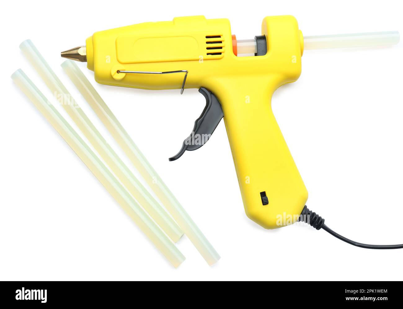 Yellow glue gun and sticks on white background, top view Stock Photo