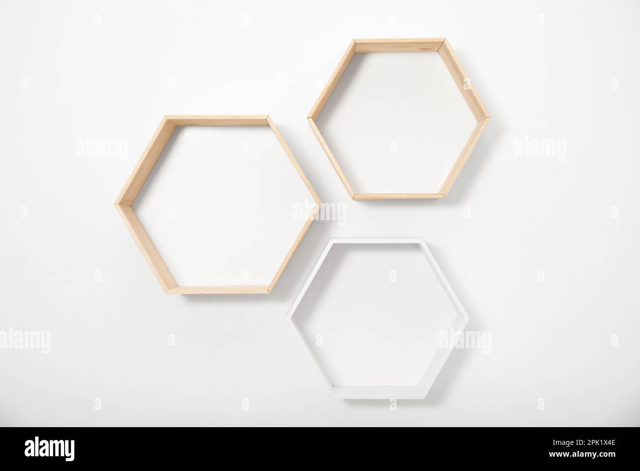 Empty shaped shelves on white wall Stock Photo Alamy