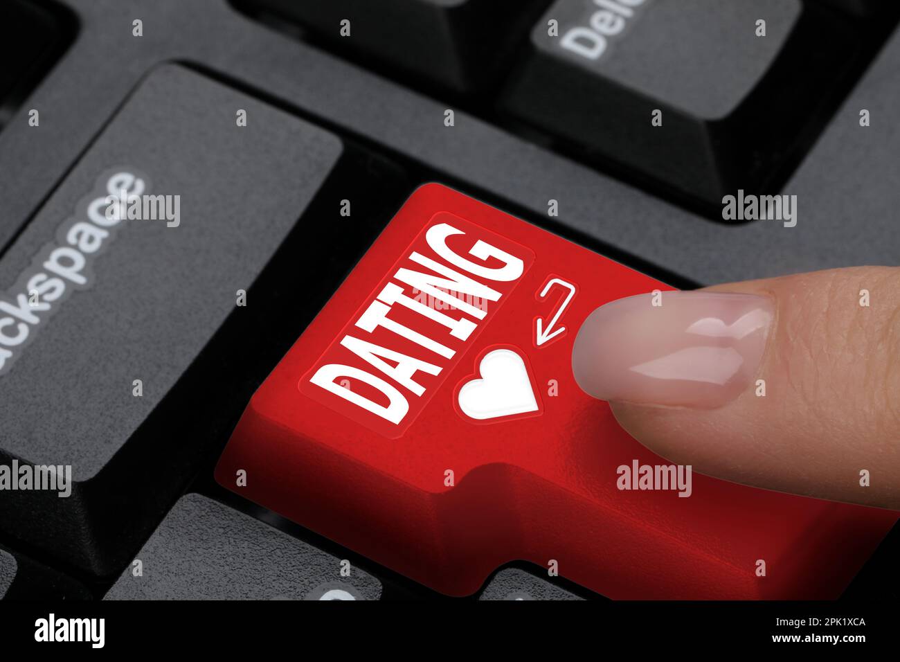 Woman pressing button with word Dating on computer keyboard, closeup Stock Photo
