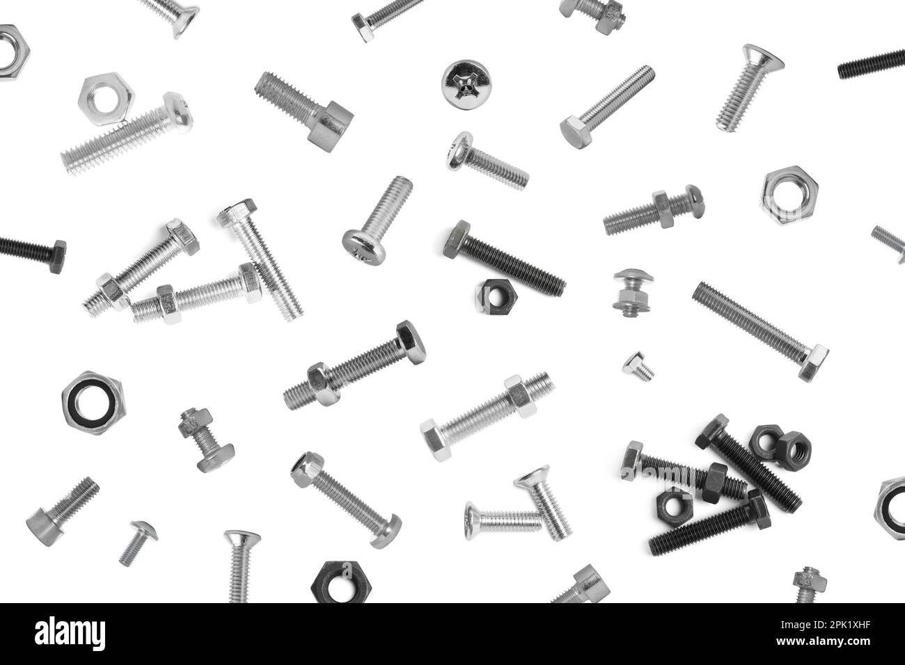 Many different bolts and nuts falling on white background Stock Photo