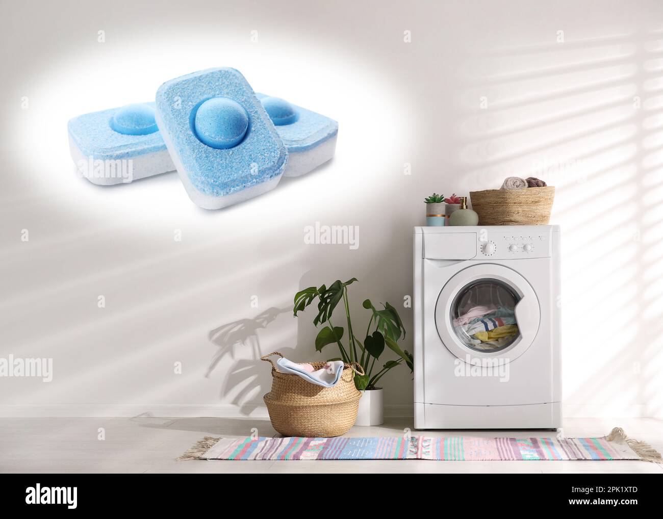 Image of water softener tablets and modern washing machine in laundry