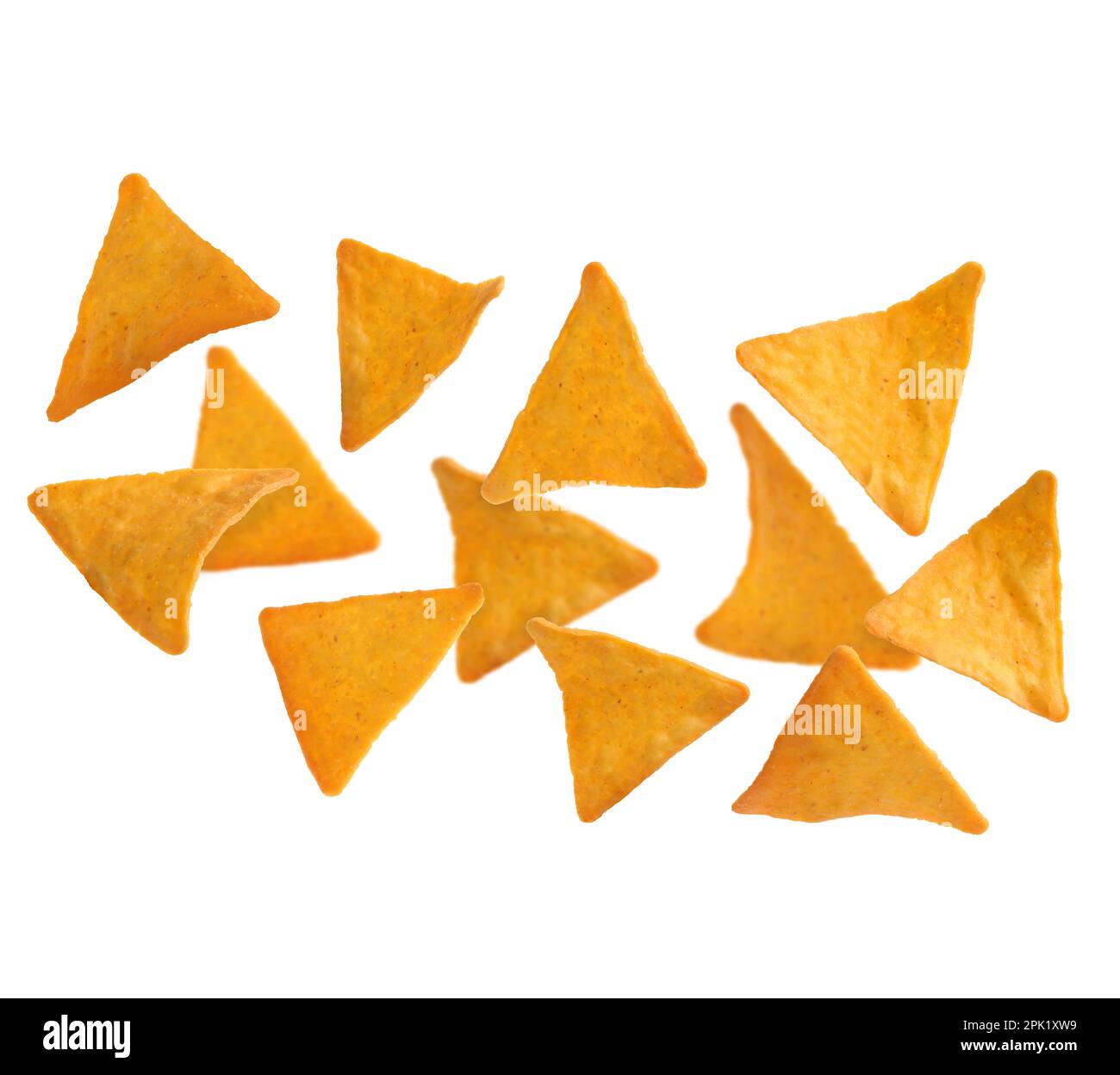 Tasty tortilla chips (nachos) falling on white background Stock Photo