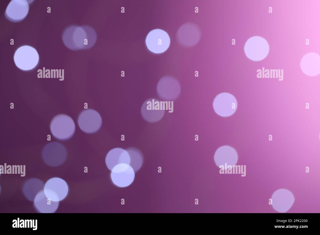 Blurred view of festive lights on purple background. Bokeh effect Stock ...