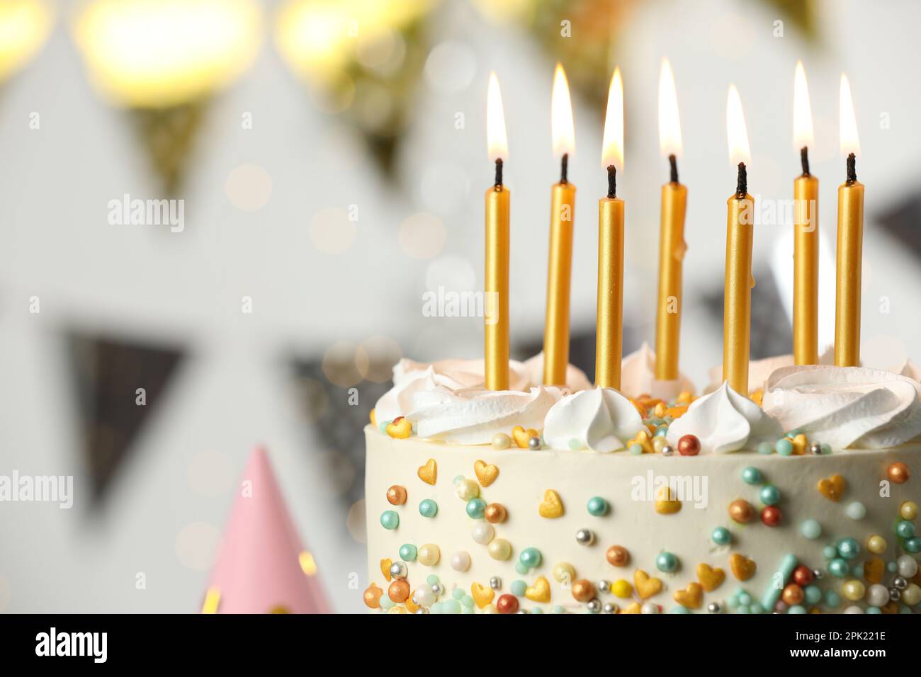 Beautiful birthday cake with burning candles on blurred background ...