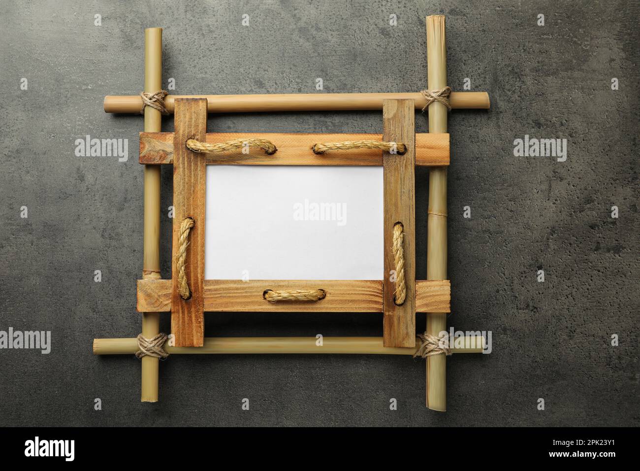 Empty bamboo frame on grey table, top view Stock Photo - Alamy
