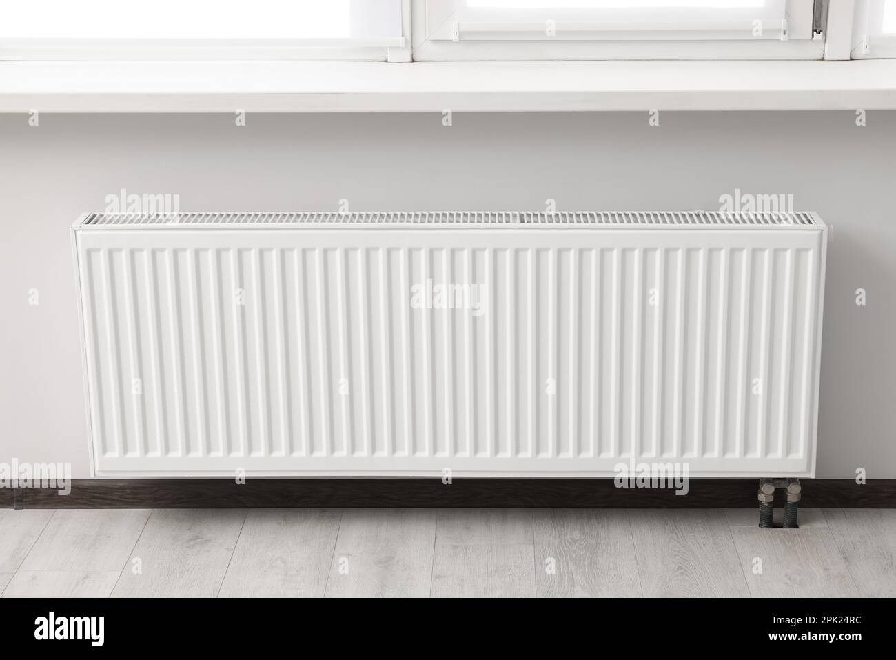 Modern radiator in room. Central heating system Stock Photo Alamy