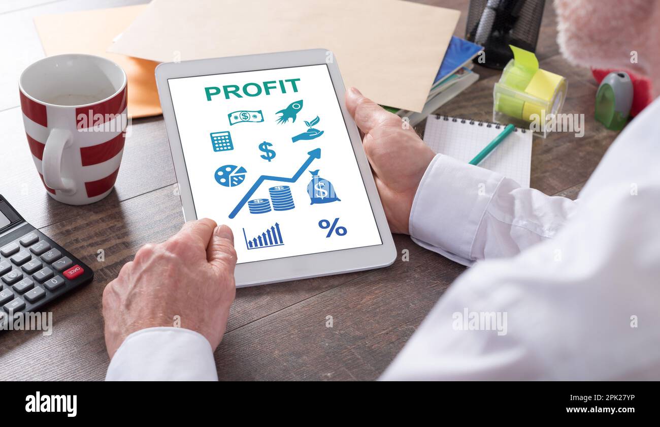 Profit concept shown on a tablet held by a man Stock Photo